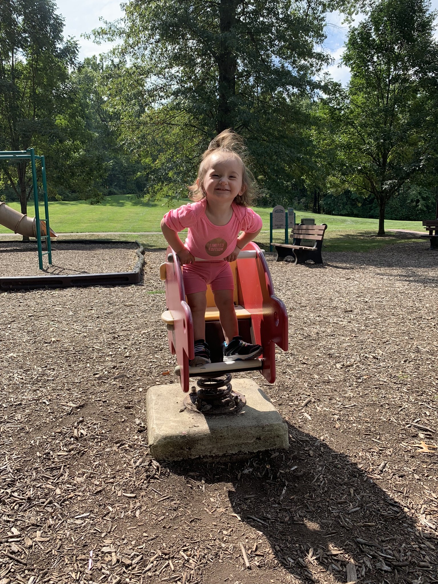 little girl smiling at the camera at a northeast ohio park