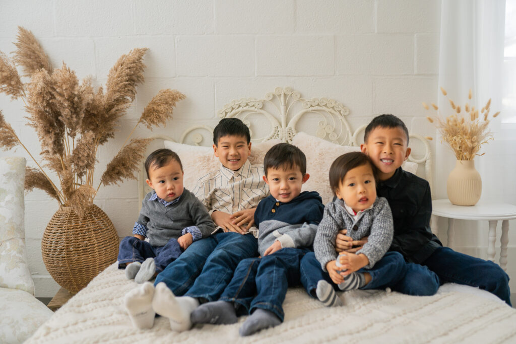 four boys smiling at the camera